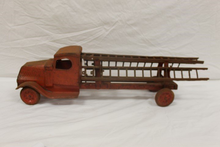 Pressed steel ladder truck, app. 23" excluding ladders.: Pressed steel ladder truck, app. 23" excluding ladders. Rust and paint loss.
