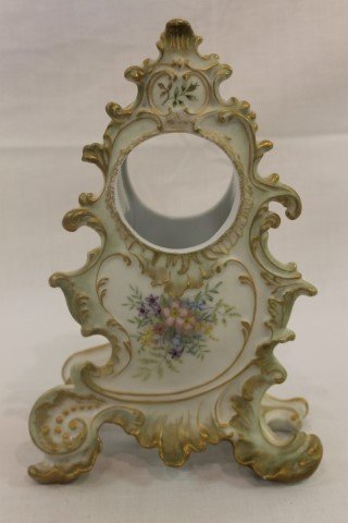 Coiffe Limoges floral decorated clock case with 2 5/8': Coiffe Limoges floral decorated clock case with 2 5/8' opening. App. 10 5/8" tall, 7" wide at base.
