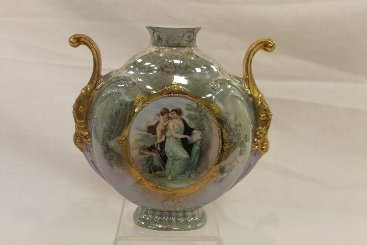 Royal Saxe E.S. Germany 7 5/8" lustre finish portrait: Royal Saxe E.S. Germany 7 5/8" lustre finish portrait vase with gold mask handles. Semi-nude lady with putti.