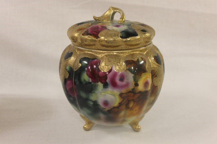 Royal Kinran Nippon footed melon form cracker jar with: Royal Kinran Nippon footed melon form cracker jar with roses and gold decoration, app. 8 1/4" tall, minor gold wear.