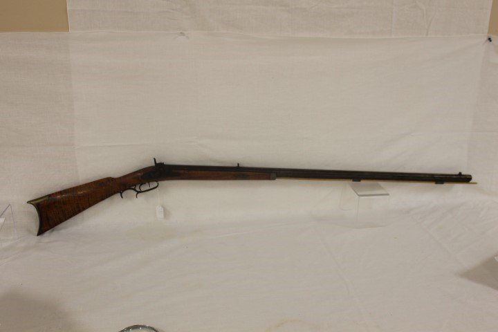 C. 1850 curly maple half stock cap lock long rifle.: C. 1850 curly maple half stock cap lock long rifle. App. 57 1/8" long.