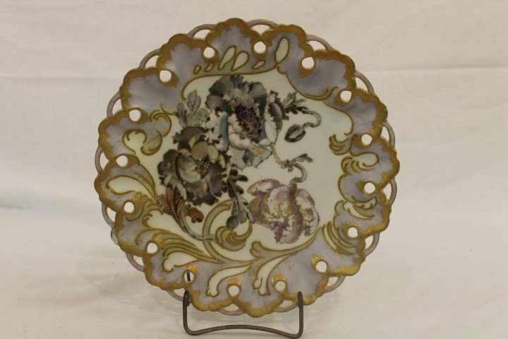 Pairpoint Limoges 9 3/16" reticulated floral plate with: Pairpoint Limoges 9 3/16" reticulated floral plate with gold and lavender border. Small overpainted chip on rim.