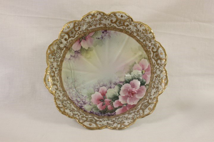 Green M with wreath Nippon pedestal bowl with: Green M with wreath Nippon pedestal bowl with restoration on one lobe. Rayed interior with satin floral decoation and elaborate gold trim, 11 1/4" wide, 3 3/4" tall.