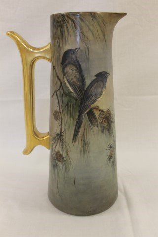 T&V Limoges 14 5/8" tankard decorated with birds: T&V Limoges 14 5/8" tankard decorated with birds perched on pine boughs with pine cones. Faint artist signature believed to be Louise Taylor.