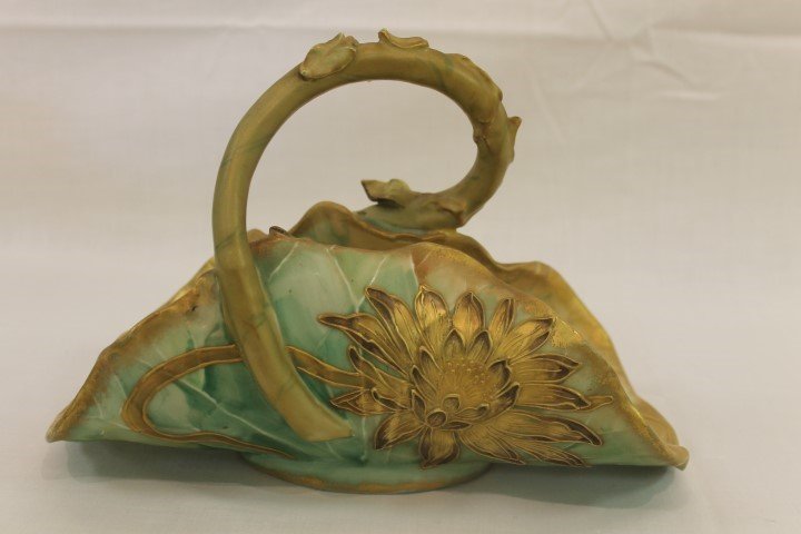 Rare Pairpoint Limoges molded leaf form basket with: Rare Pairpoint Limoges molded leaf form basket with stem handle and molded water lilies with heavy gold decoration. App. 10 3/4" long, 7" tall, 5" wide. 2022/56