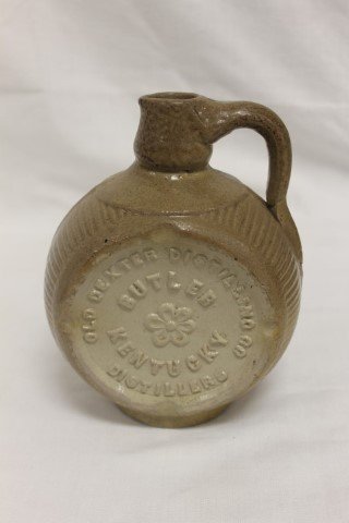 The Old Dexter Whisky Jug, Old Dexter Distilling Co.: The Old Dexter Whisky Jug, Old Dexter Distilling Co. Distillers Butler, Kentucky Pat. Aug. 11. 189`1. Minor separation where handle meets body and on seam at base; minor loss at base of handle. 7 1/4"