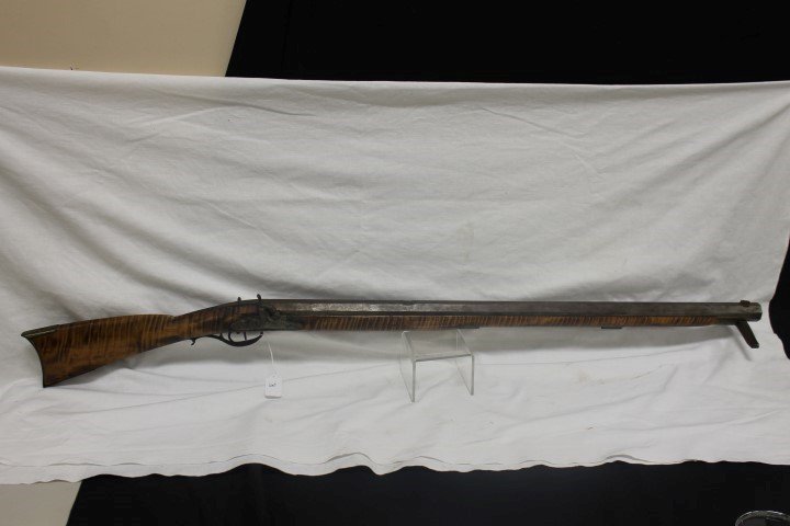 C. 1865 "Over-the-log" target rifle with figured maple: C. 1865 "Over-the-log" target rifle with figured maple stock. Barrel engraved "B.E. Reedy", with lock with faint partially legible marking for "William ____ ridge". Beautiful stock. App. 52" long. .50