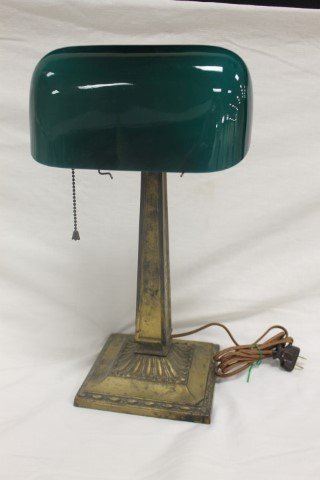 1930's desk lamp with original green cased Emeralite: 1930's desk lamp with original green cased Emeralite shade with partial label. App. 16 3/4" tall, base is 6 3/4" wide. With Emeralite Desk Lamp brass tag, No. 8734. No wing nut on knuckle.