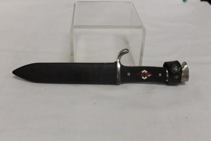 Traditional Hitler Youth knife with scarce double: Traditional Hitler Youth knife with scarce double maker's mark on blade. Marked RZM M7/42 1938 and WKC Solingen. Blade shows only minor use and wear, sheath with eagle and swastika. Blade is 5 5/16",