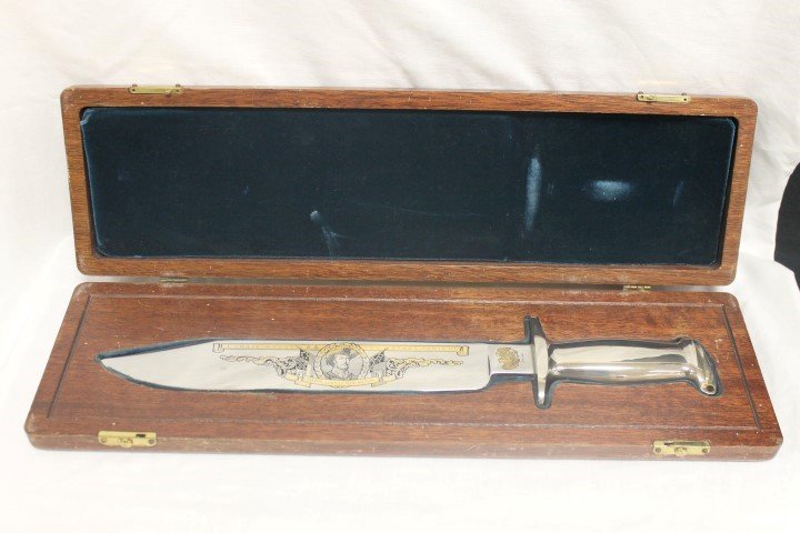 German-made John Singleton Mosby large steel Bowie: German-made John Singleton Mosby large steel Bowie knife with gold etching. 17 1/4" overall length, in custom fitted wooden case. Marked USHS 1988. Apparent gold loss on handle cap, minor scratching.