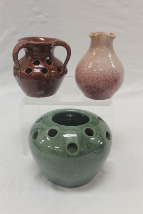 Cornelison Pottery: maroon 3-handle frog vase 3 5/8": Cornelison Pottery: maroon 3-handle frog vase 3 5/8" with rim nick and heavy crazing; 4 1/4" maroon to cream cracquel finish pinch lip vase with rim chips; and blue/green 3 3/4" frog vase.