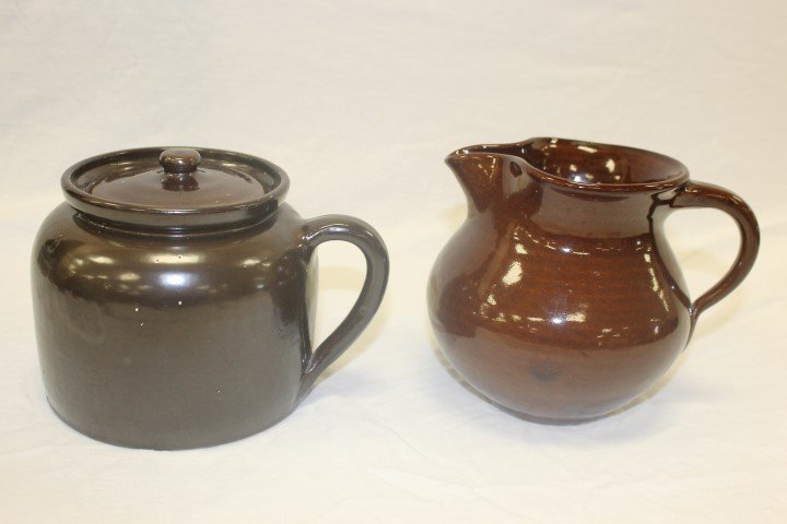 Cornelison Pottery: 5 3/8" pinch lip brown pitcher and: Cornelison Pottery: 5 3/8" pinch lip brown pitcher and 4 3/4" handled covered bean pot.