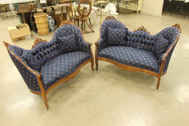 Pair of Victorian carved back settees in matching: Pair of Victorian carved back settees in matching upholstery