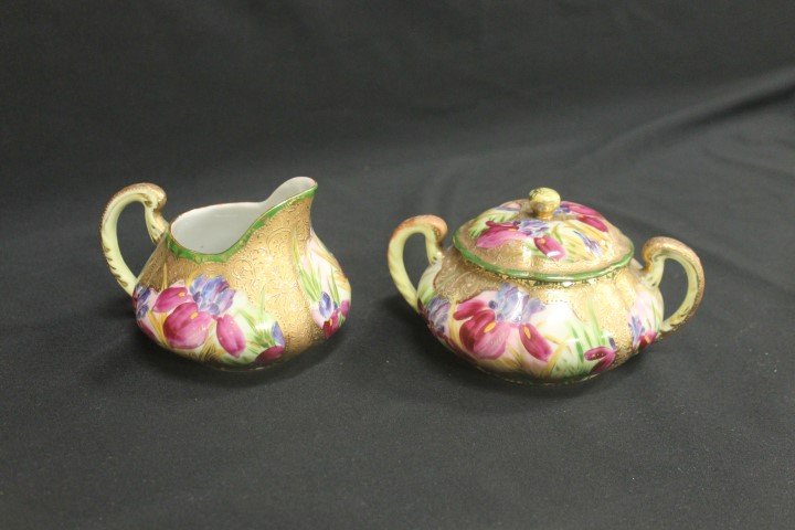 Nippon style gold decorated covered sugar and creamer: Nippon style gold decorated covered sugar and creamer with iris and heavy gold decoration. Red heart shaped mark on base with oriental characters.