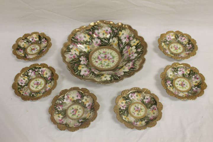 Nippon ice cream set with 11" shallow master bowl with: Nippon ice cream set with 11" shallow master bowl with heavy gold border, center ring, beading, and elaborate leaf and stem background. Minor gold rim wear. Unmarked.