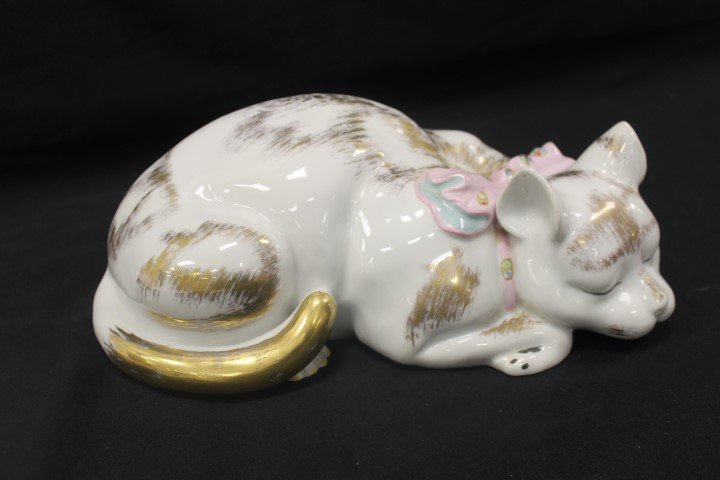 Royal Porcelain Manufacturer, RPM Berlin, large: Royal Porcelain Manufacturer, RPM Berlin, large sleeping cat decorated with pink ribbon and gold highlights. Factory line under cats' chink, 12 3/4" long, 7" wide, 5" tall.