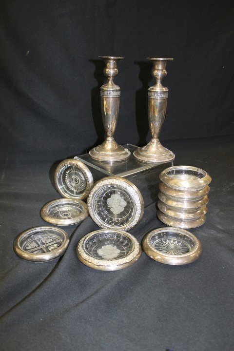 Sterling silver: Pair of Manchester #22 *" weighted: Sterling silver: Pair of Manchester #22 *" weighted candlesticks; coasters: (2) floral border with acid cut frosted fruit in base; (5) Frank M. Whiting #04 with beaded rims; (2) marked S/C with triple