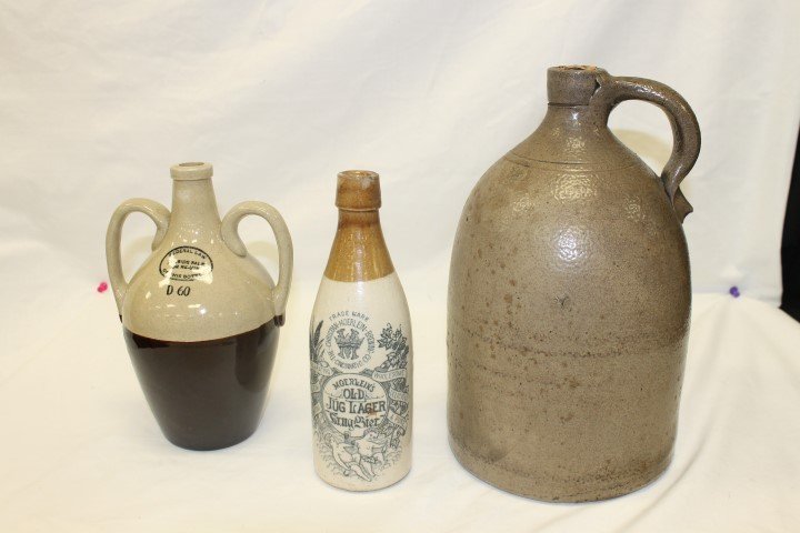 One gallon stone jug, 11 1/2", Moerlein's Old Jug Lager: One gallon stone jug, 11 1/2", Moerlein's Old Jug Lager 8 3/4" bottle with minor rim chips; 2-handle jug marked D60 and "Federal law Forbids Sale or Re-Use of this Bottle", 8 3/4"