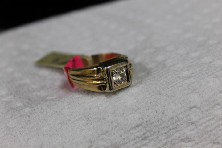 Gents 14K yellow gold diamond solitaire ring set with: Gents 14K yellow gold diamond solitaire ring set with an old European cut diamond of app. .59 ct. 6.4g. Replacement value: $1,600.