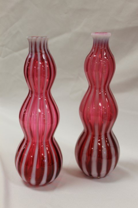 Pair of early Fenton cranberry opalescent ribbed gourd: Pair of early Fenton cranberry opalescent ribbed gourd shaped decanters, 11 3/4" and 12" tall, without stoppers.