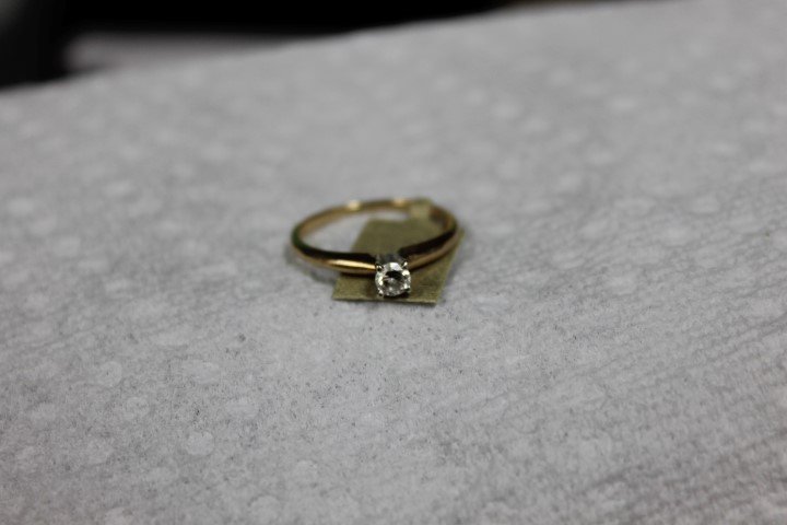 Ladies 14k yellow gold .18 ct. diamond solitaire with: Ladies 14k yellow gold .18 ct. diamond solitaire with round brilliant cut diamond. Stamped inside ring. 1.6 g. Replacement value: $375