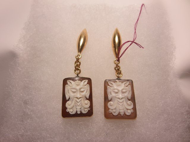 18K yellow gold brown shell cameo earrings: 18K yellow gold brown shell cameo earrings with a square shape, measuring 15.5mm X 20mm. 8.05 gram, without backs.Estimated Replacement Value: $800 per Insurance Appraisal Report dated August 18, 2015