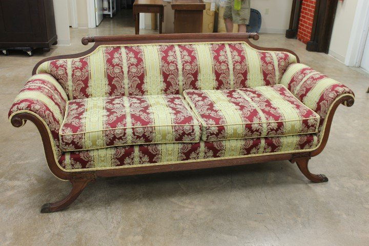 Duncan Phyfe sofa upholstered in red and gold damask,: Duncan Phyfe sofa upholstered in red and gold damask, with damage to back left foot.