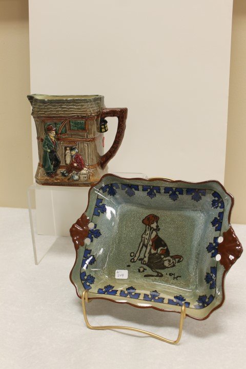 Royal Doulton Oliver Twist 5 3/4" pitcher with Fagin,: Royal Doulton Oliver Twist 5 3/4" pitcher with Fagin, Bumble, Oliver and Artful Dodger, with Royal Doulton Titamian 10" handled tray with a portrait of a dog, signed, D4525, with factory flaw in base.
