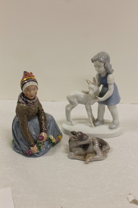 Royal Copenhagen 5 3/4" kneeling girl with flowers,: Royal Copenhagen 5 3/4" kneeling girl with flowers, marked Tano, Denmark, 12413, 99X with minor loss on flower petals; Bing & Grondahl 3" calf, 2168, signed PG; 6 1/2" Bavarian girl with a deer.