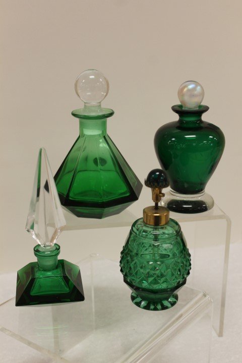 Green perfumes: panelled 6" marked Al Piombo Cristallo;: Green perfumes: panelled 6" marked Al Piombo Cristallo; bulbous with lustre stopper; faceted and cross hatched atomizer; faceted with clear spearpoint stopper