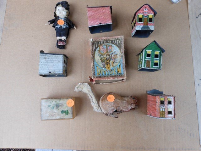(5) litho tin buildings, 2 3/4", no base; Ademup Card: (5) litho tin buildings, 2 3/4", no base; Ademup Card game, 5" tall, wind-up beaver, 7" long, 5" celluloid doll, tooth powder box, 3 1/2"