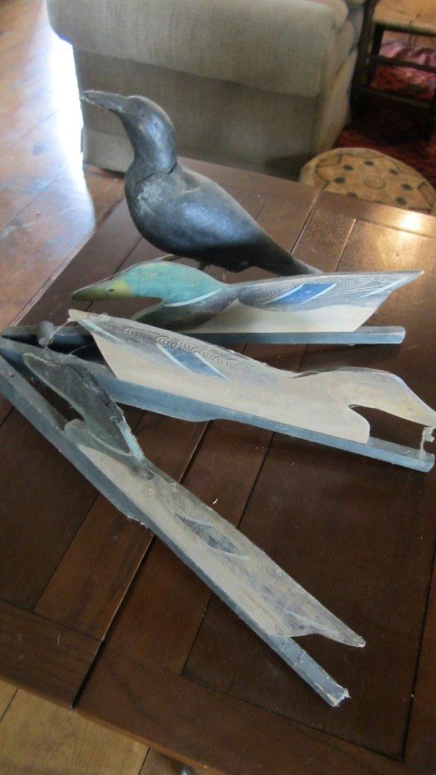 10" wooden crow/raven and (3) hinged wooden decoys,: 10" wooden crow/raven and (3) hinged wooden decoys, app. 20" long. Raven signed CW under tail, neck has been separated.