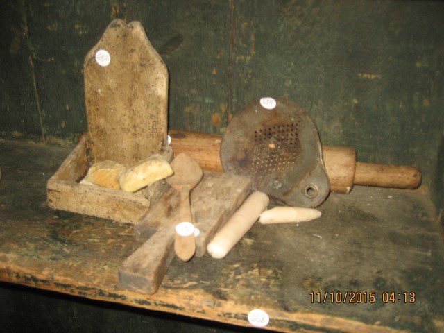 Grouping: whale oil lamp, wooden rolling pin, wood: Grouping: whale oil lamp, wooden rolling pin, wood mold, tin strainer, wood spoon, wood hanging soap box