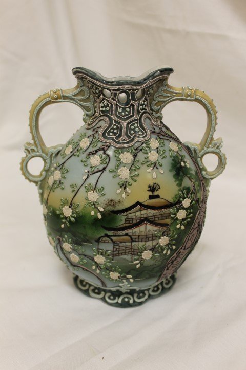 I.E. Co. Japan Hand Painted Nippon-style vase with: I.E. Co. Japan Hand Painted Nippon-style vase with applied moriage decoration. Some loss, 8 1/8" tall, 2-handles.