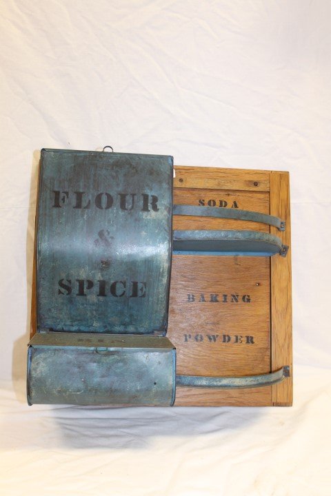 Hanging painted and stenciled tin and oak rack with: Hanging painted and stenciled tin and oak rack with Flour and Spice bin, and Soda and Baking Powder shelves. Former kitchen cabinet door with hangers is app. 9" deep, 17 1/4" tall, 18 1/2" wide.