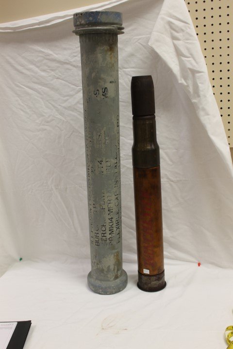 Winchester dummy artillery shell in original aluminum: Winchester dummy artillery shell in original aluminum case. Shell is 29 5/8" tall with no end cap; case is 37" and marked 3" Tank, Mark V-1, PMC 1942.