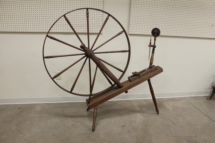 Early spinning wheel reported to have originated in: Early spinning wheel reported to have originated in Nicholas County, KY and being marked on the end "B. Colvin 1860". Very good overall condition. Wheel is app. 43 1/4" wide.