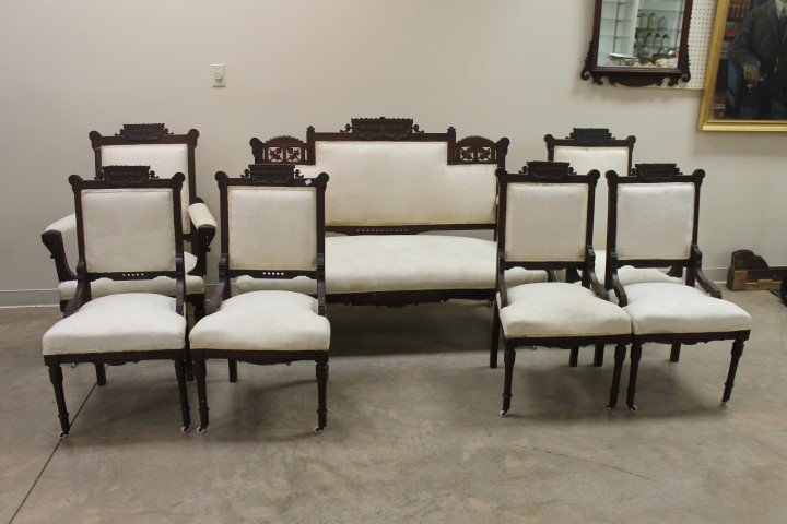 Walnut carved back 7 pc. Parlor set with pressed and: Walnut carved back 7 pc. Parlor set with pressed and pierce carved florals. 4 side chairs, platform rocker, arm chair and settee. Settee is 41 1/4" tall, 54" wide, 22" deep and 16 1/2" tall at the sea