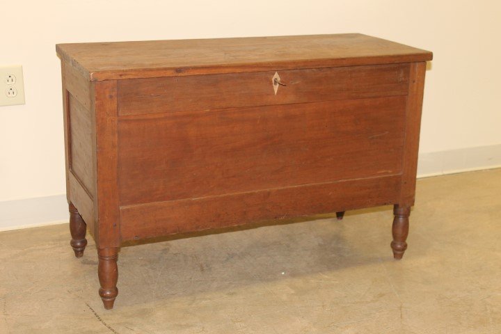Walnut blanket chest with keyhole inlay and interior: Walnut blanket chest with keyhole inlay and interior til. On turned feet, 24 1/2" tall, 37 1/2" wide, 16 1/2" deep.