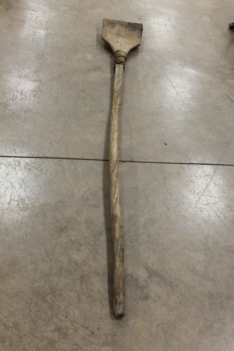 Long handle bread board with birch or sycamore pole: Long handle bread board with birch or sycamore pole attached by leather to a bread board paddle. 61 1/2" pole overlapping to attach to 19 1/2" bread board with tin patching.