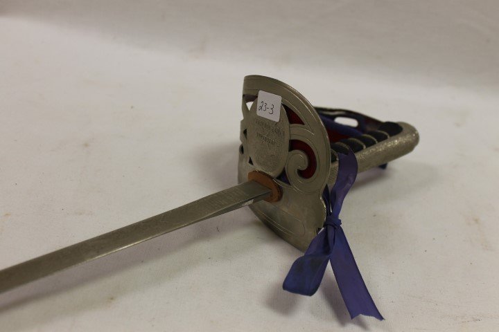 Wilkinson Sword "By appointment to Her majesty Queen: Wilkinson Sword "By appointment to Her majesty Queen Elizabeth II Sword Cutters" London, Made in England, with etched blade with some pitting. App. 36 1/2".