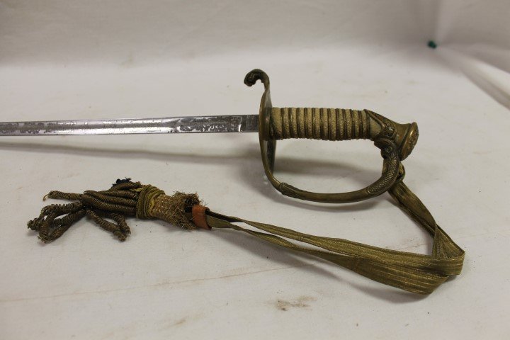 R.S. Meyer, Inc Defender with etched USN blade, dolphin: R.S. Meyer, Inc Defender with etched USN blade, dolphin handle ends, USN with oak leaf and acorn design on guard, wit partial portapee. Stamp inside 6-point star marked "Proved", 35 1/2" long.