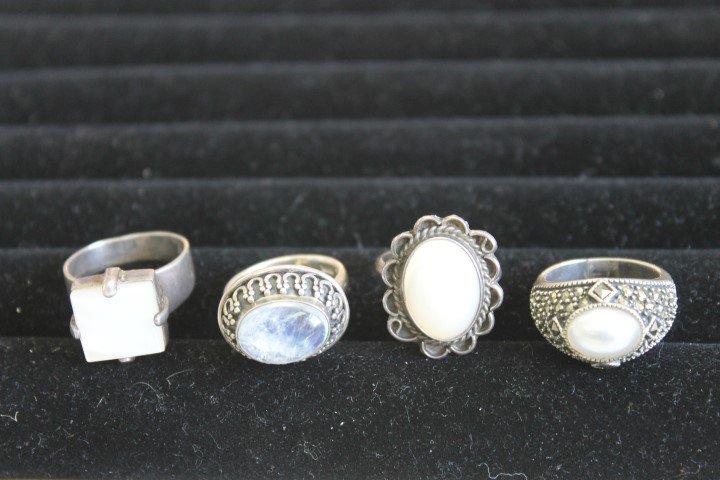 Sterling silver rings: Signed India 925 with oval mood: Sterling silver rings: Signed India 925 with oval mood stone set in horseshoe border, Size 7; Size 9 with mother-of-pearl set in 4-prong setting; Size 8 with mother-of-pearl oval and wrapped line bord