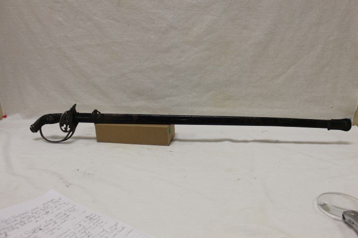 Fine 1889 German/Prussian Officer's sword with folding: Fine 1889 German/Prussian Officer's sword with folding guard, Good overall condition, 37 1/2", with Willhelm II insignia on handle.