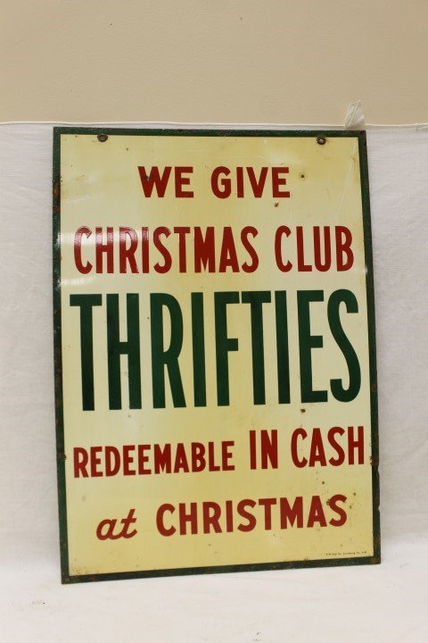 "We Give Christmas Club Thrifties" double sided tin sig: "We Give Christmas Club Thrifties" double sided tin sign marked A-M Sign Co. Lynchburg, VA 4-54. 20" X 28", with rust and loss, some bubbled paint.