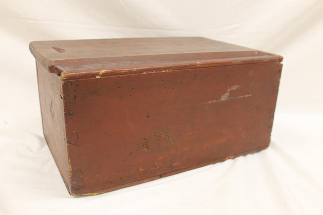 Grain painted dovetailed pine slide top box in red: Grain painted dovetailed pine slide top box in red paint with divided interior. Slide is impressed with letters SOO. 9 5/8" wide, 7 3/4" tall, 15 3/4" long with slide overhang.