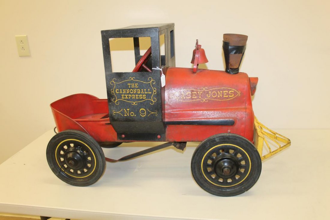 Garton Casey Jones The Cannonball Express No. 9 pedal: Garton Casey Jones The Cannonball Express No. 9 pedal car with cow kicker, bell with no clapper, and damaged stack. Red with yellow and black stencil, some pitting, overall good condition. 24" tall, 4