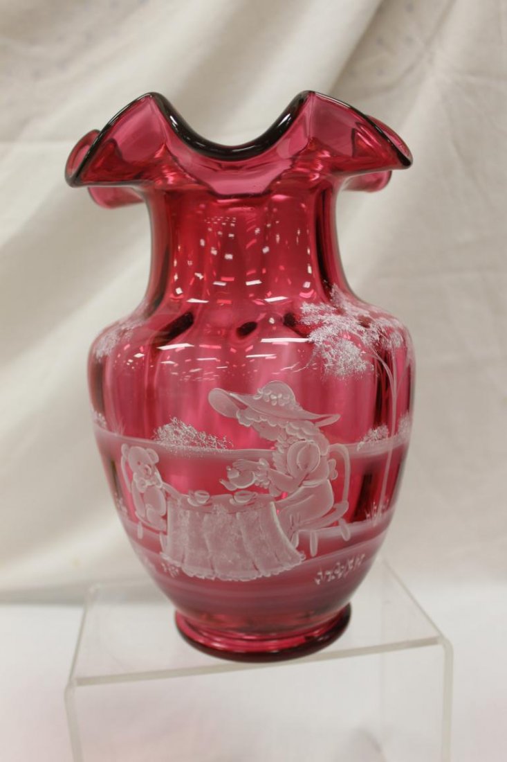 Fenton 10" ruffle top cranberry vase with Mary Gregory: Fenton 10" ruffle top cranberry vase with Mary Gregory styl decoration of a young girl and a teddy bear having a tea party. Signed "hand painted by J. Powell", #1978/2350.
