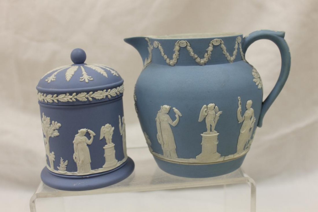 Wedgwood, England #36 4 3/4" blue Jasperware pitcher: Wedgwood, England #36 4 3/4" blue Jasperware pitcher and blue covered jar, app. 4 1/2" tall, with small interior rim nick on base. Some fading on lip of pitcher.