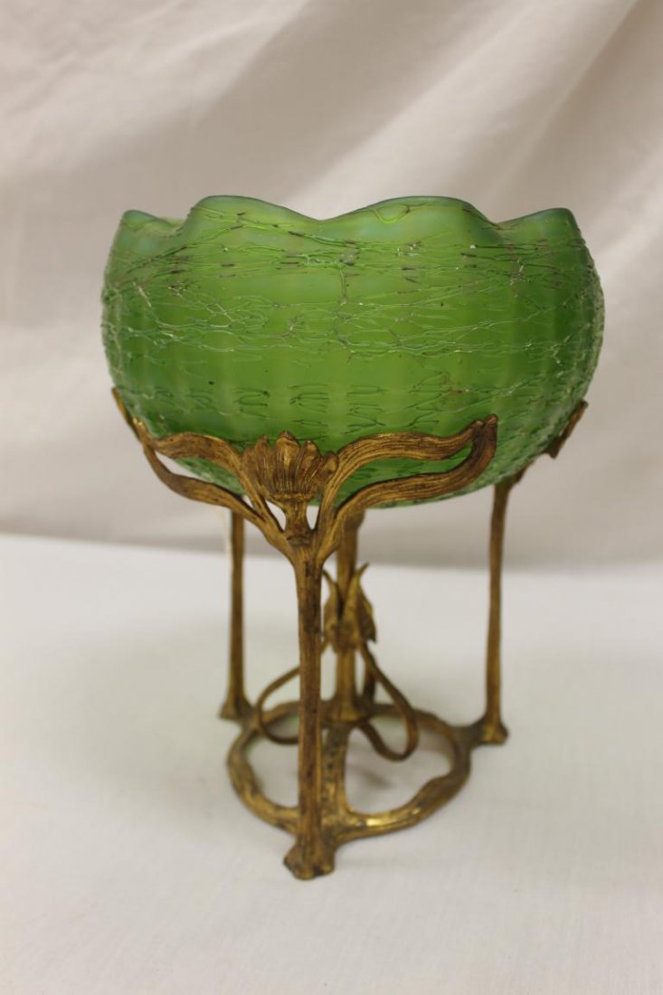 Loetz ruffle edge center bowl on an Art Nouveau base: Loetz ruffle edge center bowl on an Art Nouveau base with three supporting flower forms, app. 10" tall, 8" wide, with some minor exterior threading loss